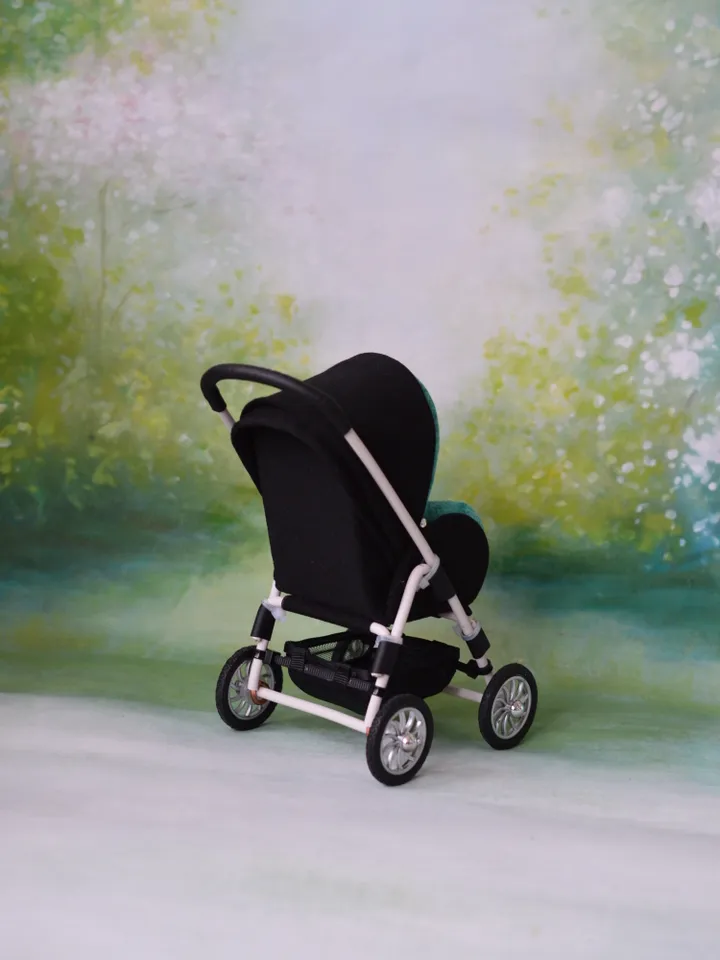 Miniature toy stroller for dolls in 1/6 scale. Accessories for small dolls and poupins. Pram for Barbie doll.