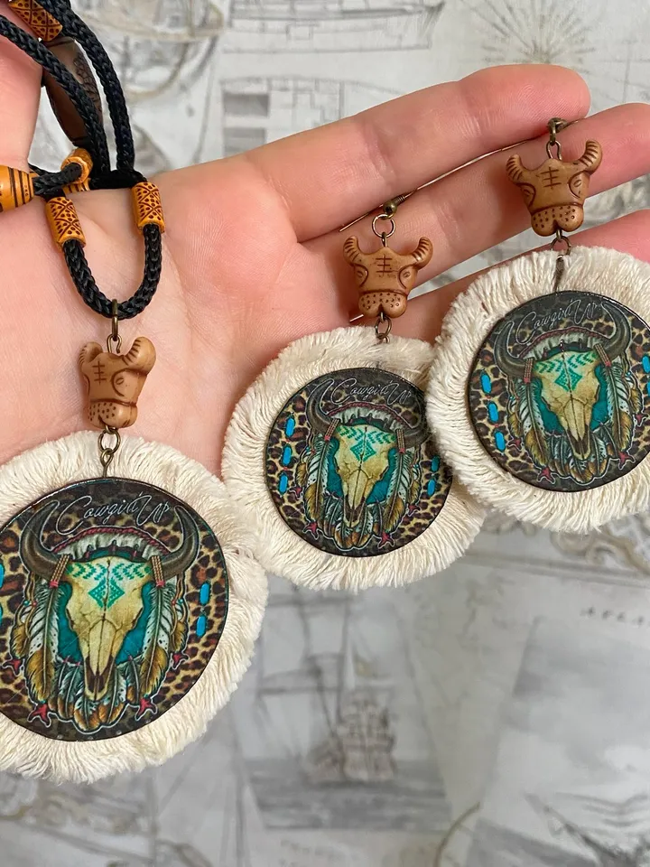 A set of interesting handmade jewelry.Handmade jewelry. Author's design. Set of earrings + pendant on a cord.
