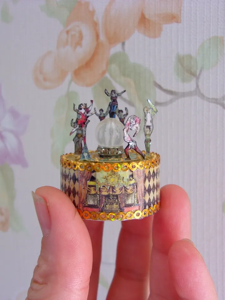 Mini circus with lights. acrobats on stage. LED candle
