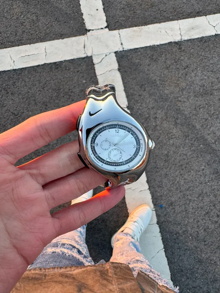 Nike Triax wristwatch: glossy silver case and dial