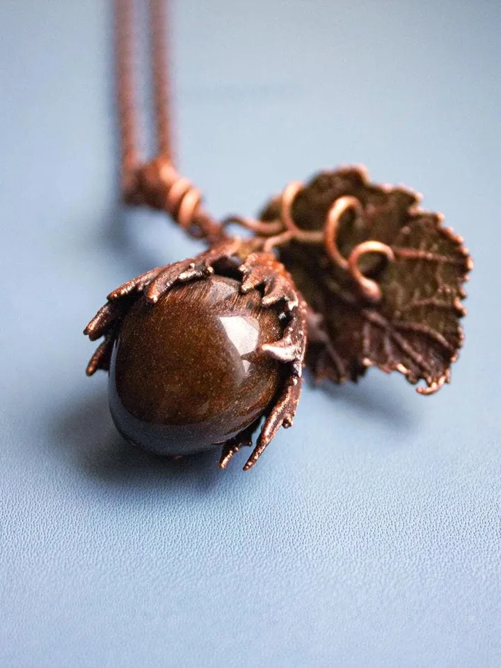 Unique handmade electroformed pendant made of natural leaves and twigs with natural tiger eye stone