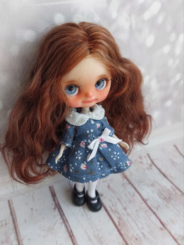 Charming little girl with brown hair and blue eyes. Author's miniature doll for your collection.