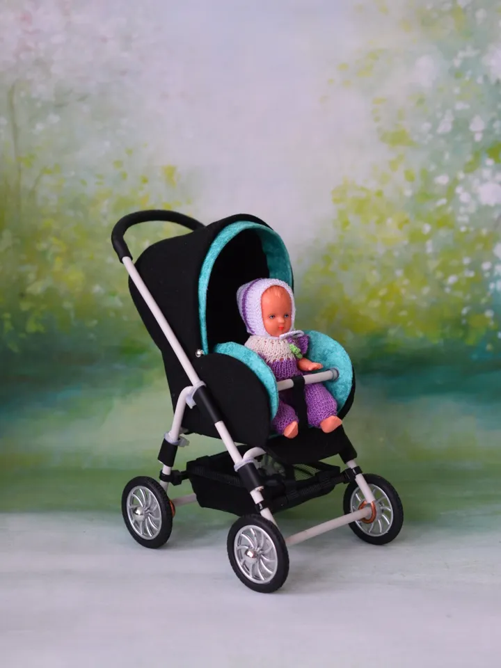 Miniature toy stroller for dolls in 1/6 scale. Accessories for small dolls and poupins. Pram for Barbie doll.