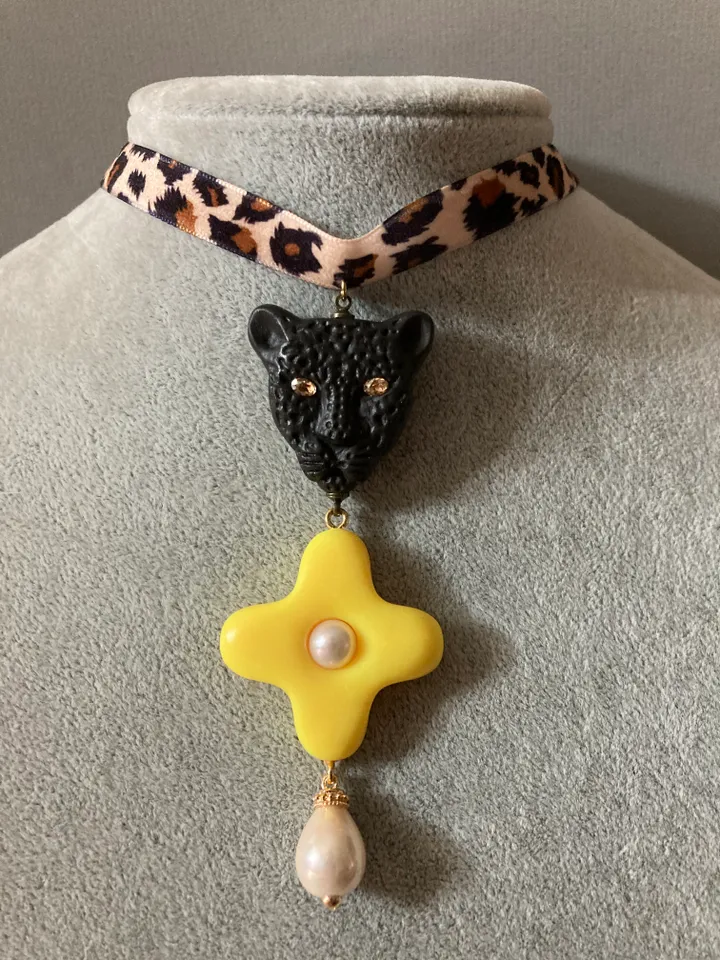 A choker around the neck on a ribbon