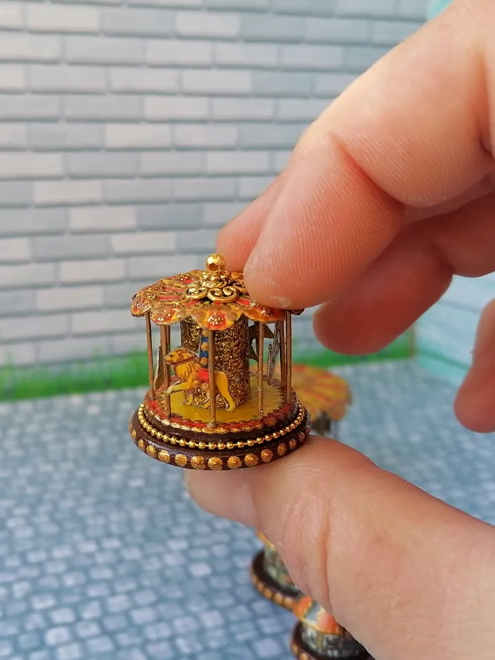 Miniature dollhouse carousel with gold trim. 1:12. Dollhouse miniature.