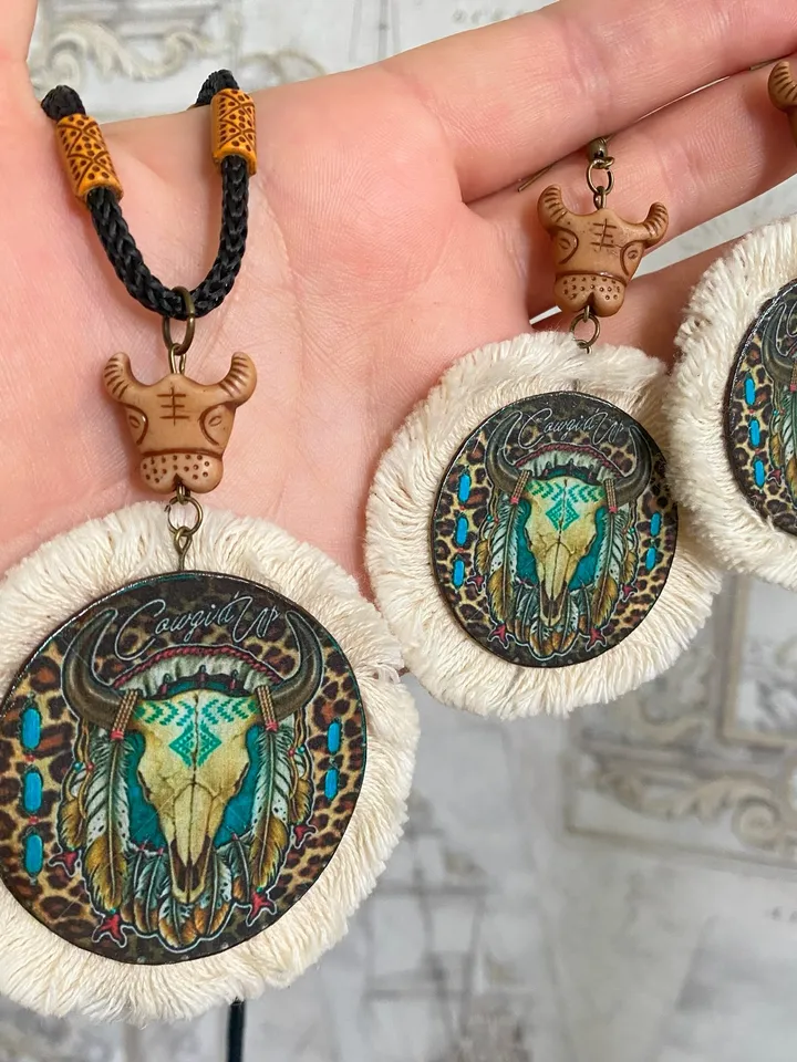 A set of interesting handmade jewelry.Handmade jewelry. Author's design. Set of earrings + pendant on a cord.