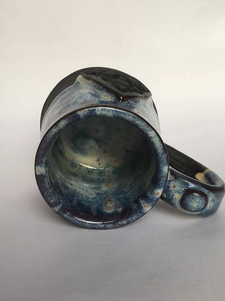 Trinity knot Triquetra in circle blue and black galaxy glazed stoneware mug