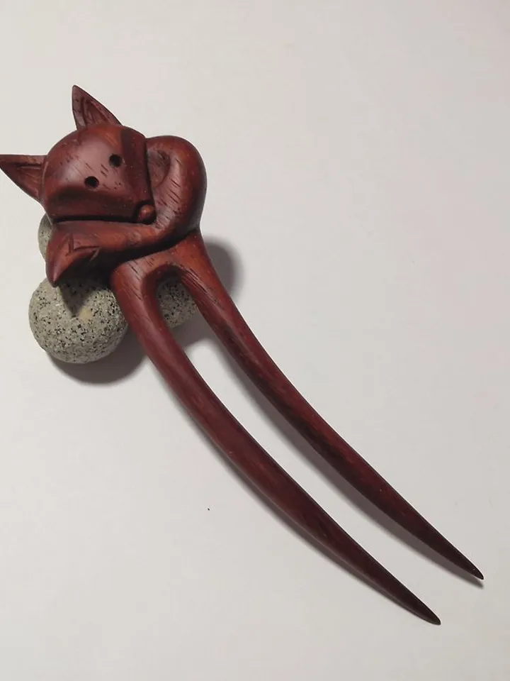 Carved wooden hairpin with a fox.