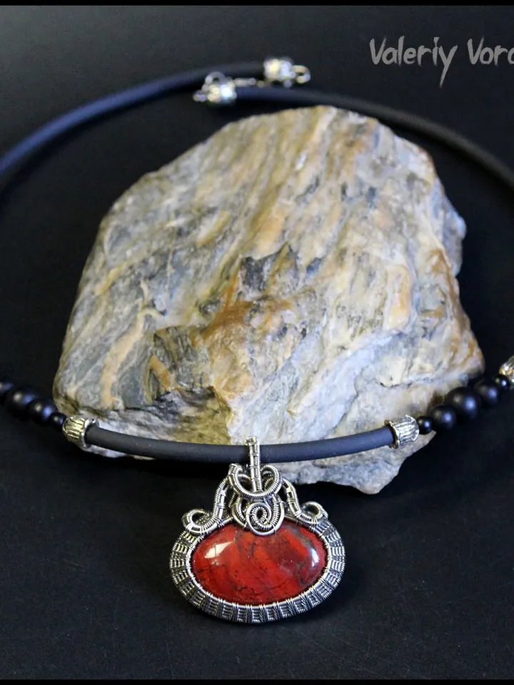 Handmade necklace with a pendant made of jasper and nickel silver wire.