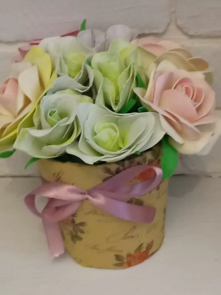 Beautiful composition of roses and eustomes in delicate colors. Handmade