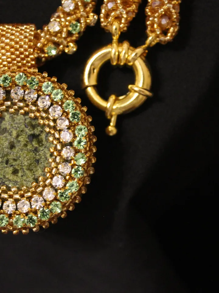 Pendant Japanese beads with a coil and rhinestones