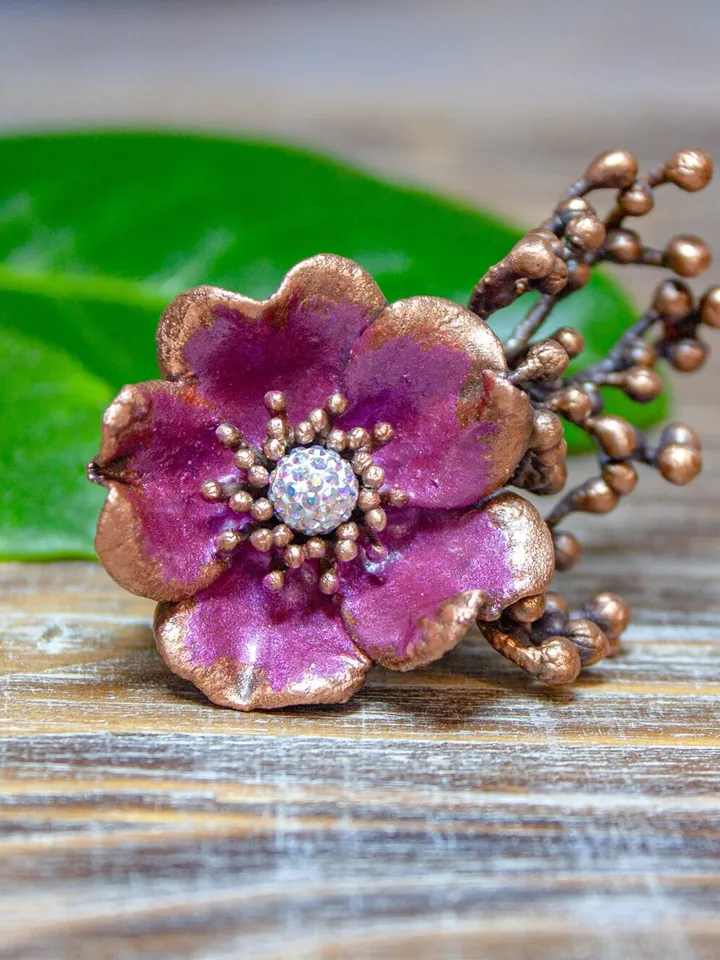 Unique handmade copper ring made from a real flower bud using the electroforming method, decorated with a Swarovski crystal