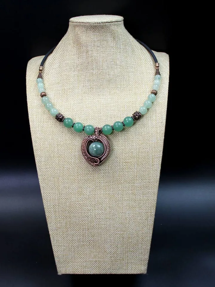 Handmade necklace with pendant made of copper wire and Indian agate stone.