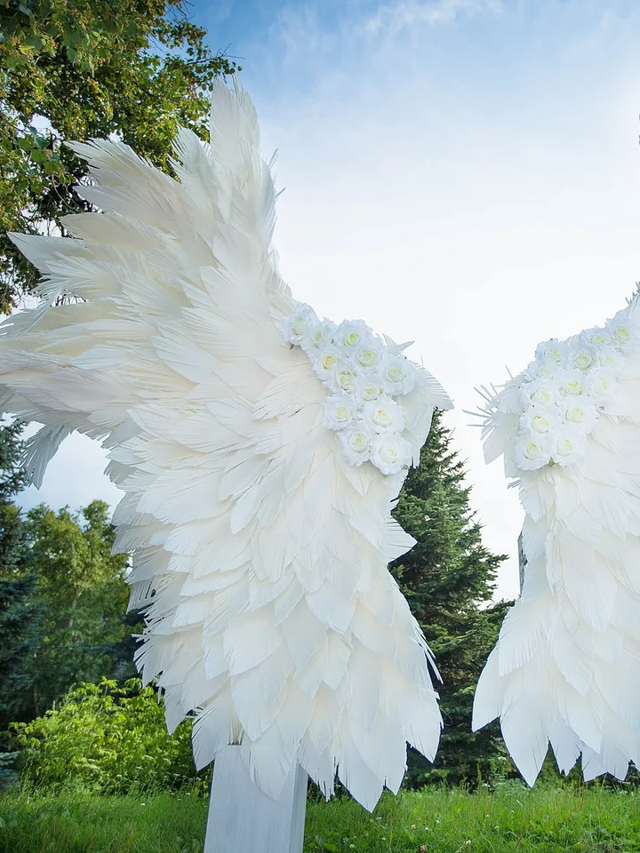 Giant angel wings wedding backdrop on metal stand, luxury street party decoration