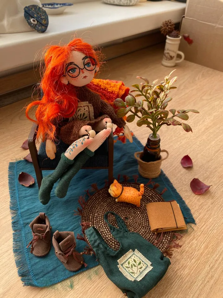 Red-haired doll with goblincore and cottagecore style with tattoos