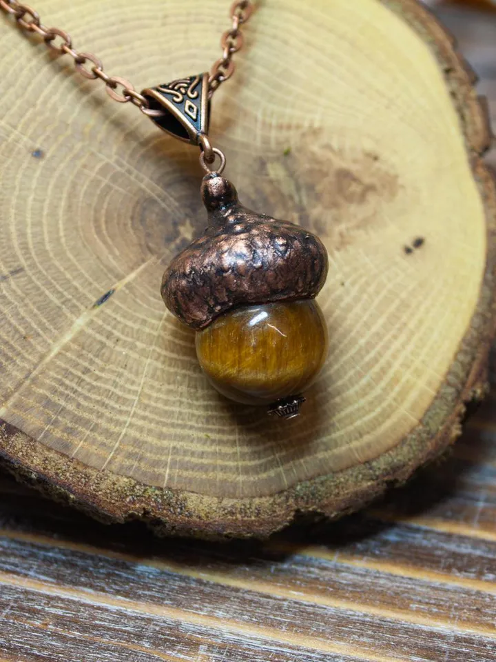 An original handmade electroformed copper pendant made from natural acorn caps in a single copy.