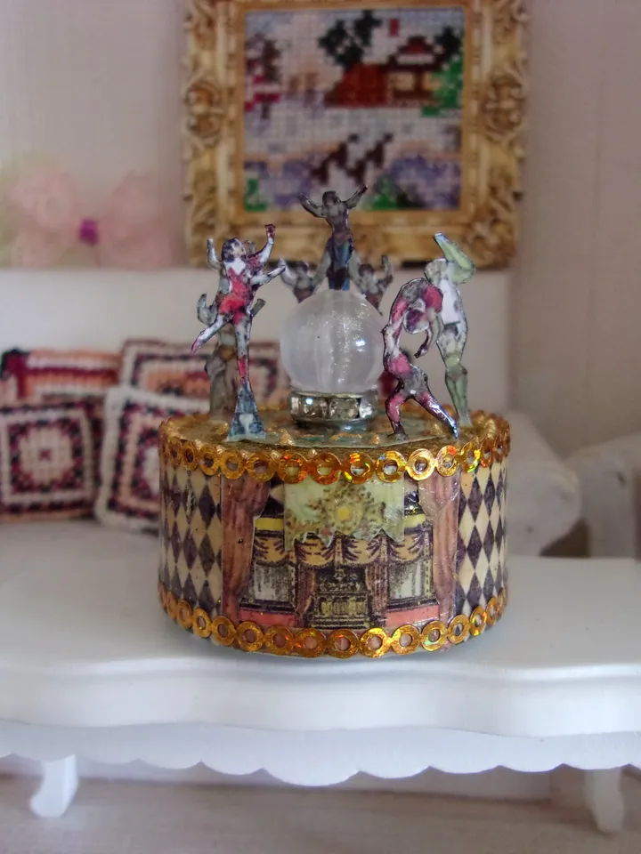Mini circus with lights. acrobats on stage. LED candle