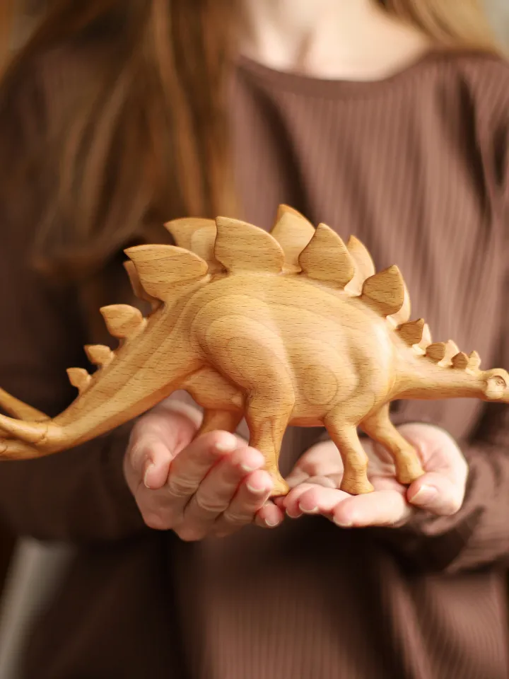 Wooden hand carved dinosaur stegosaurus