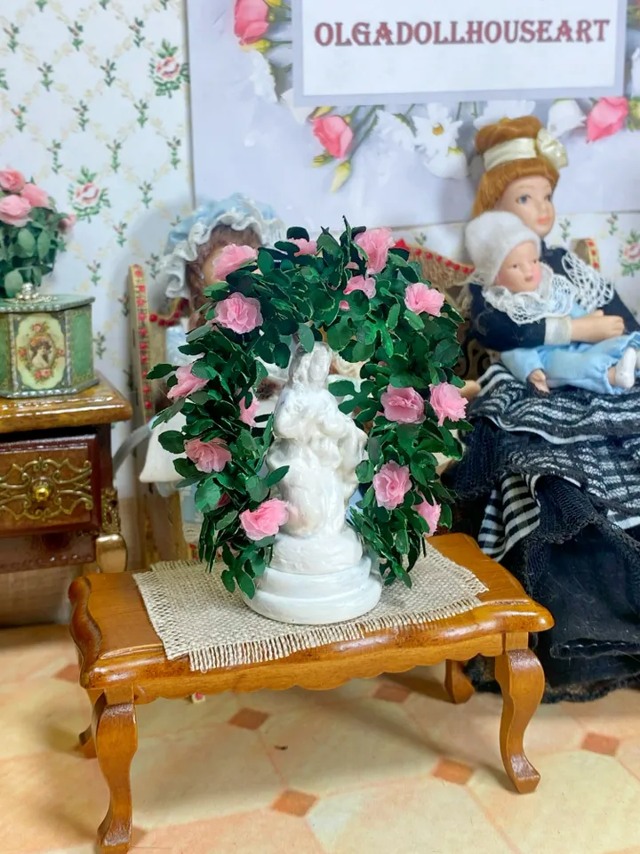 A figurine with delicate roses for a dollhouse and a park area. Dollhouse miniature. 1:12.