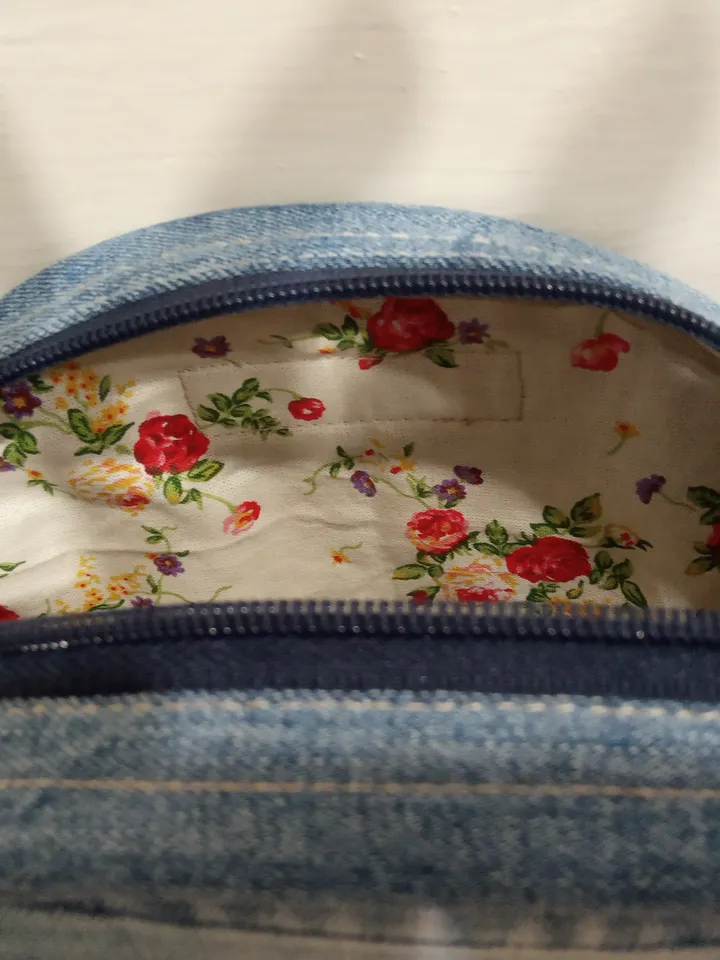 Round denim crossbody bag with a long strap