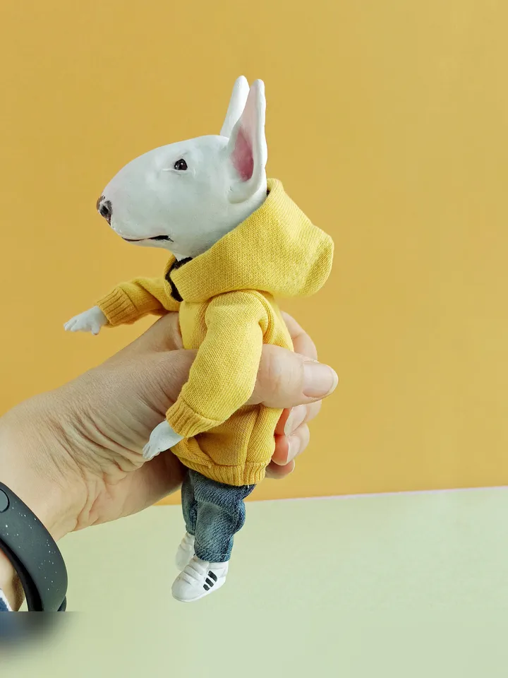Bull Terrier doll in a yellow sweater