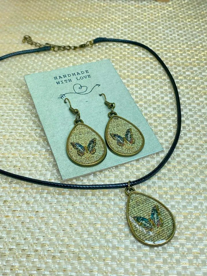 Handmade jewelry set. Shiny butterflies in a bronze frame. designer jewelry.