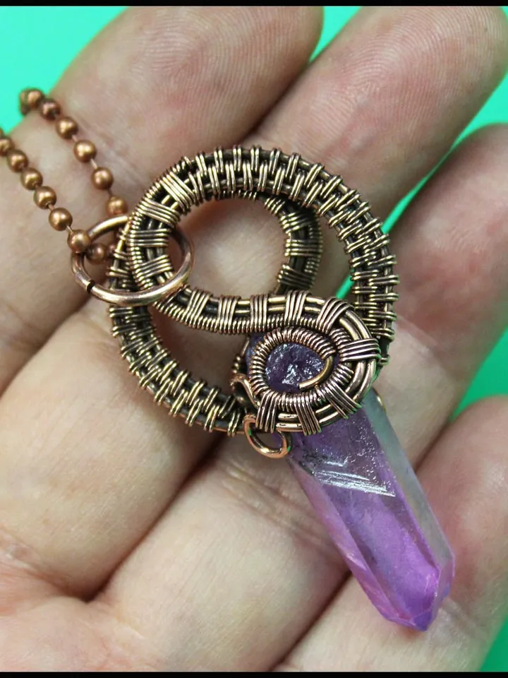 Handmade copper wire pendant with quartz crystal.