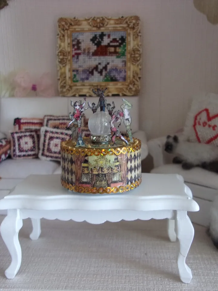 Mini circus with lights. acrobats on stage. LED candle