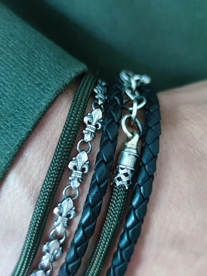 Designer multilayer bracelet with elements of chain, genuine leather and paracord
