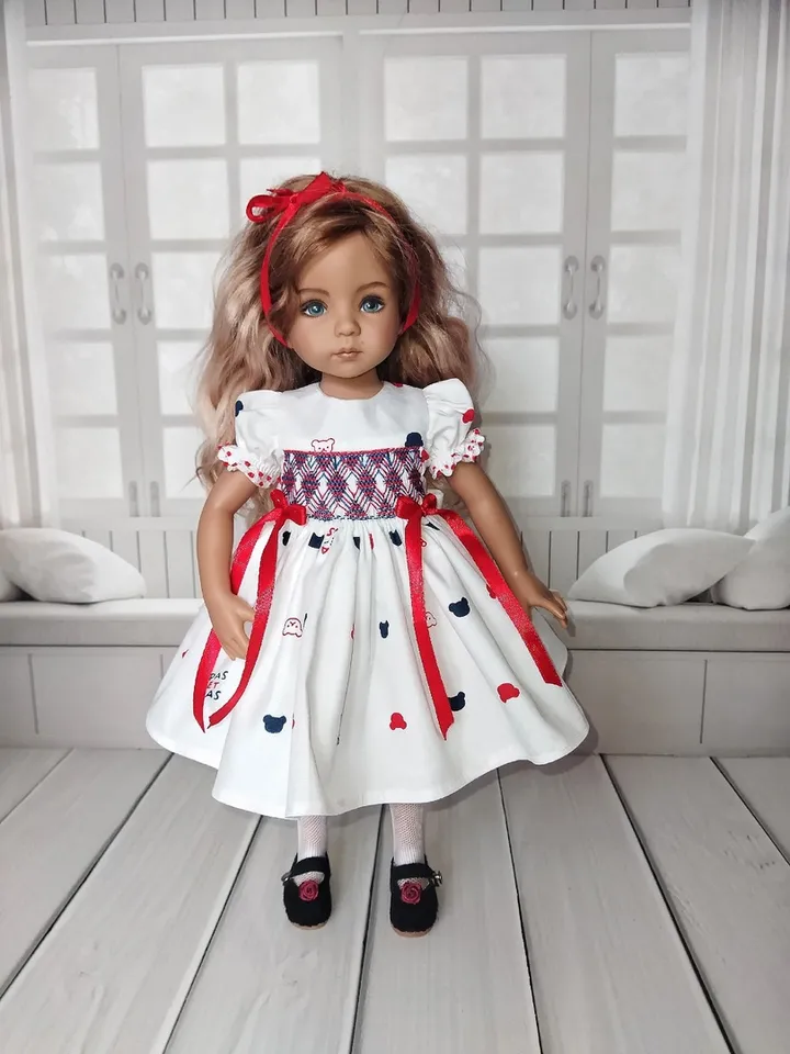 Smocked dress with hand embroidery.