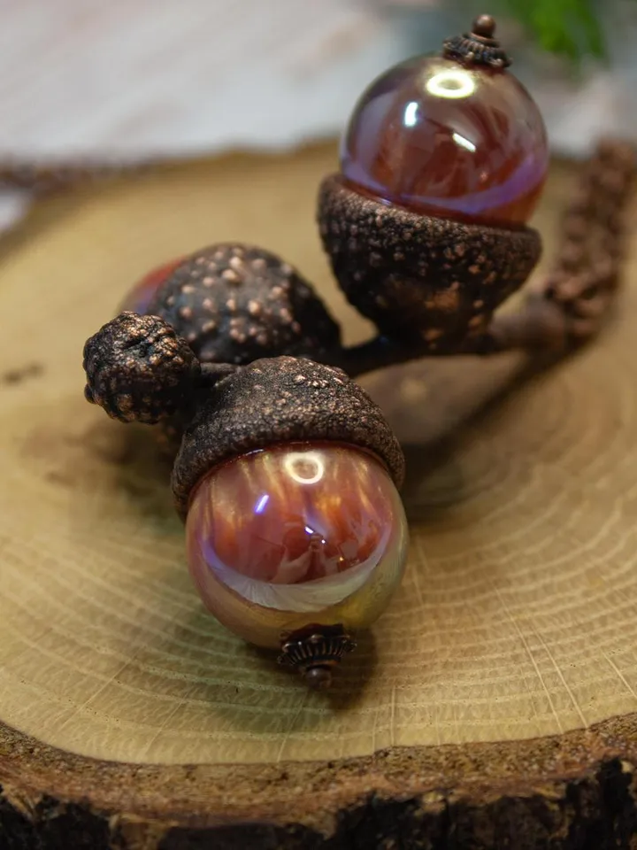 An original handmade electroformed copper pendant made from natural acorn caps in a single copy.