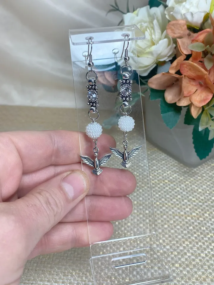 Handmade set. Handmade jewelry. Metal birds on a pendant. Handmade. Author's design.
