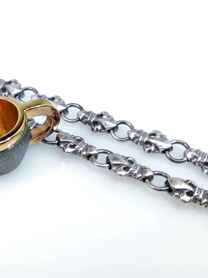Set of miniature cup and gaitan (cord)