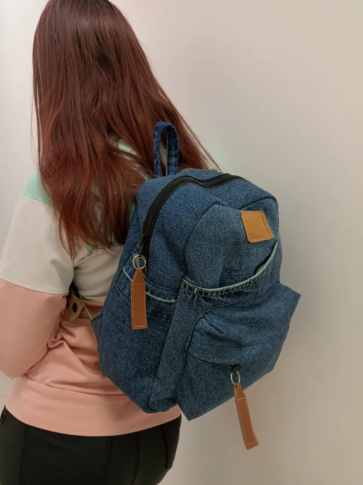 Stylish Denim backpack with 100 percent cotton lining, handmade, jeans recycling, 6 pockets.