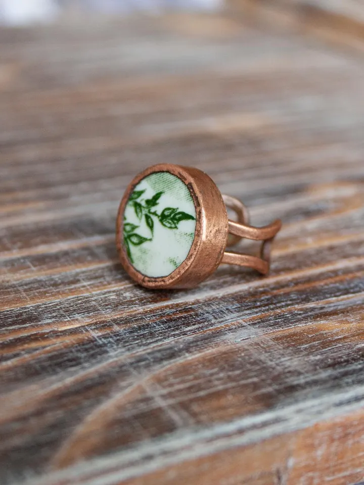 Unique handmade porcelain ring in a copper frame made using the electroforming process