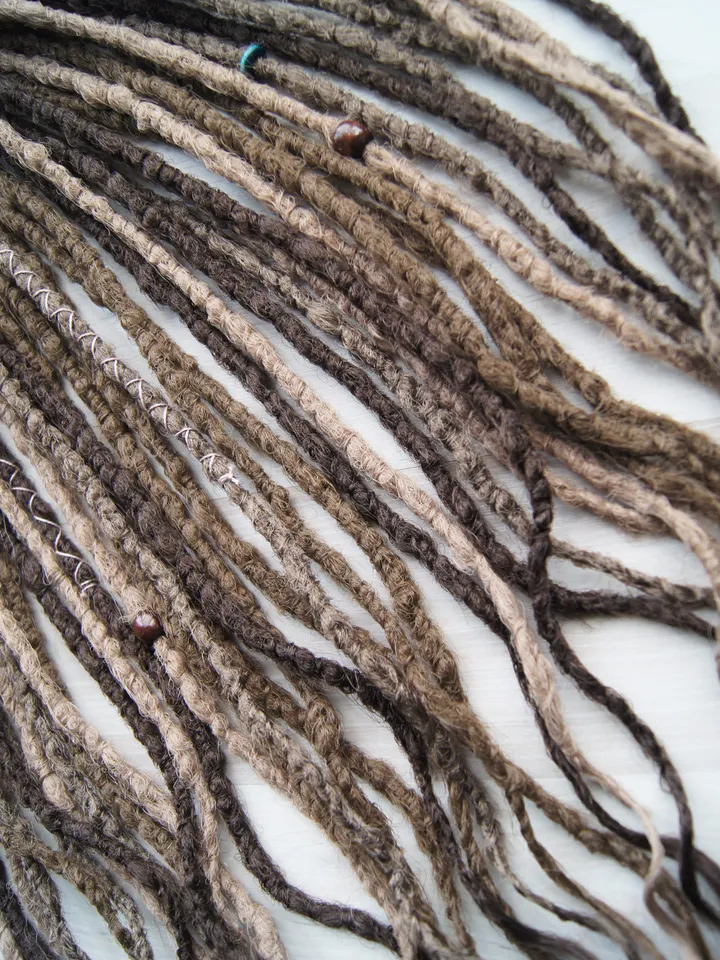 Wavy Synthetic Dreadlock Extensions in Ash Brown with Boho Beads and Wraps for Natural Looking Festival Hairstyles