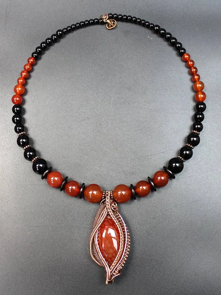 Handmade copper pendant with agate.
