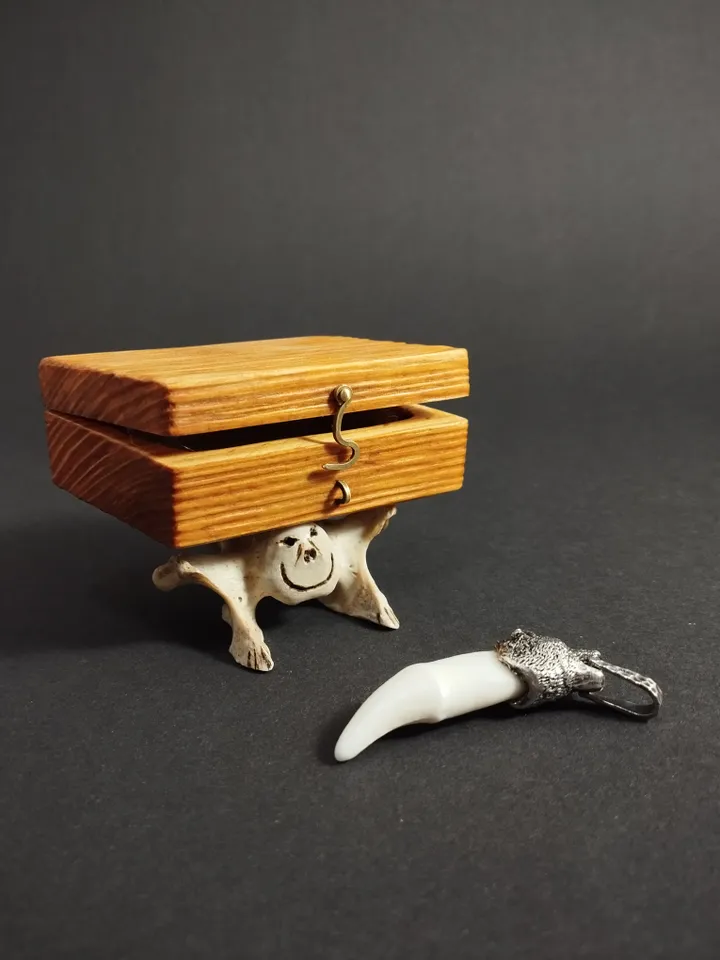 A silver-framed wolverine's fang.