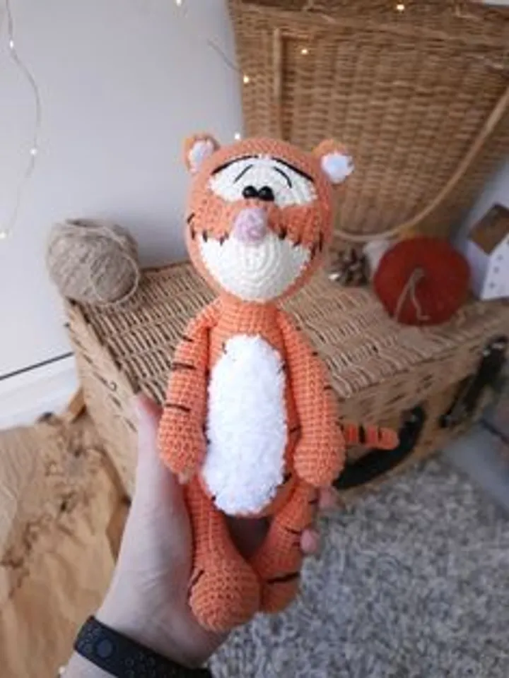 Orange tiger cub Disney cartoon character. Stuffed animal tiger soft toy