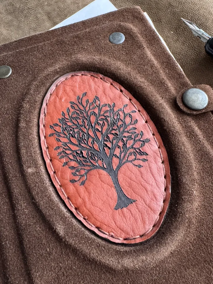 Notebook made of genuine suede with leather insert and wood engraving.