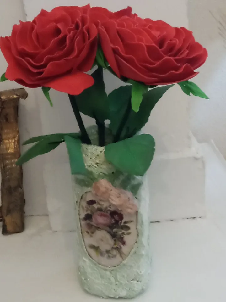 Luxurious red roses in a handmade vase