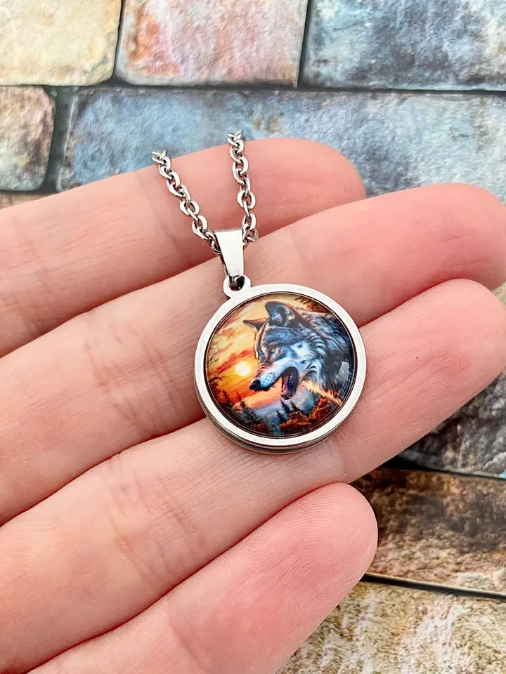 Wolf at sunset, steel pendant with glass