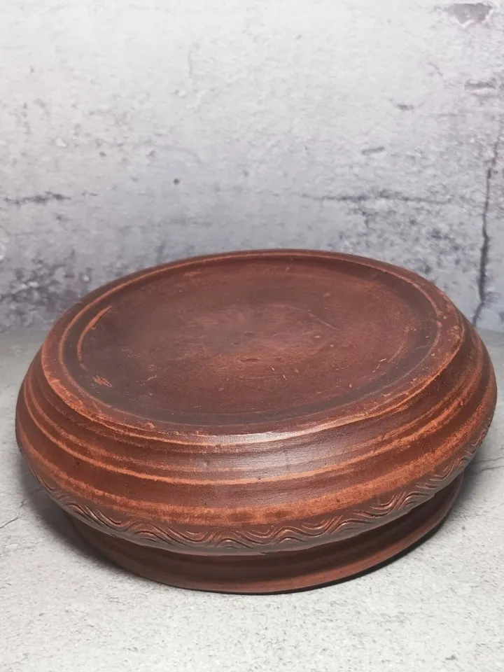 Ceramic casserole with a lid. Handmade from red clay. Carved pattern