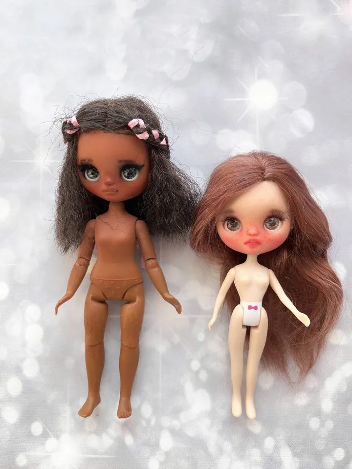 Petite Blythe with dark skin. Adorable miniature doll on an articulated body.