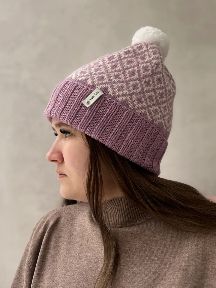 Warm womens hand-knitted hat