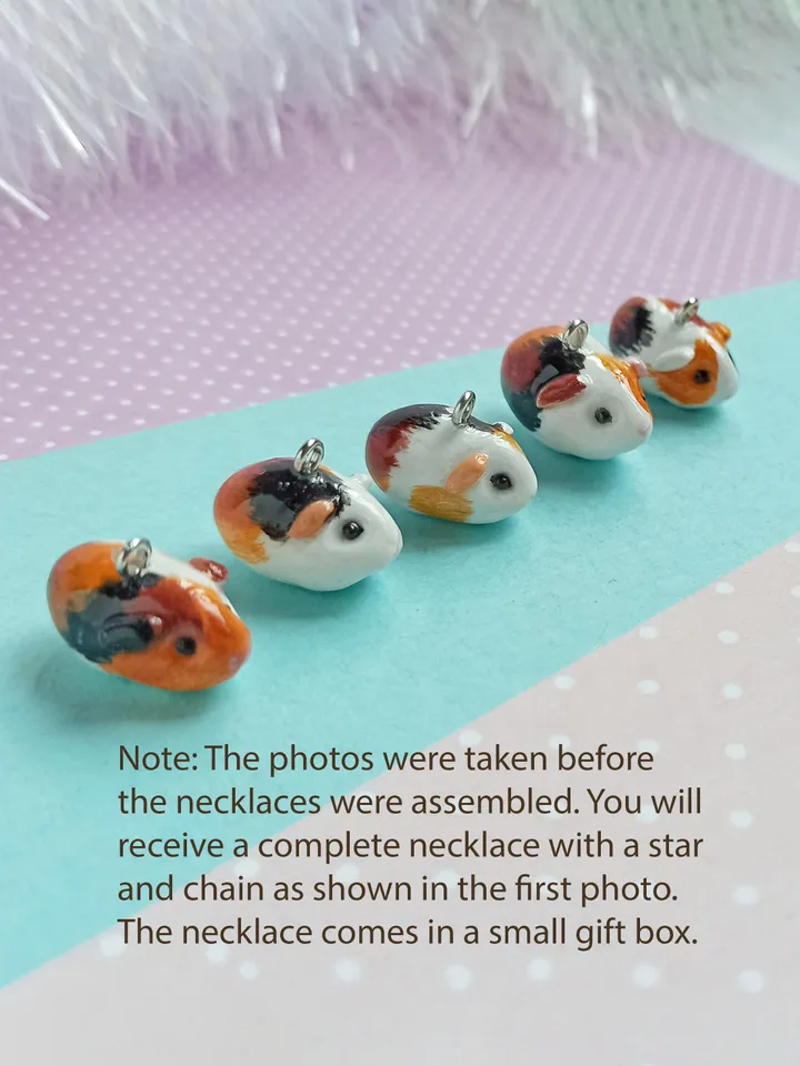 a Handmade guinea pig necklace rundom color  (pre-order)