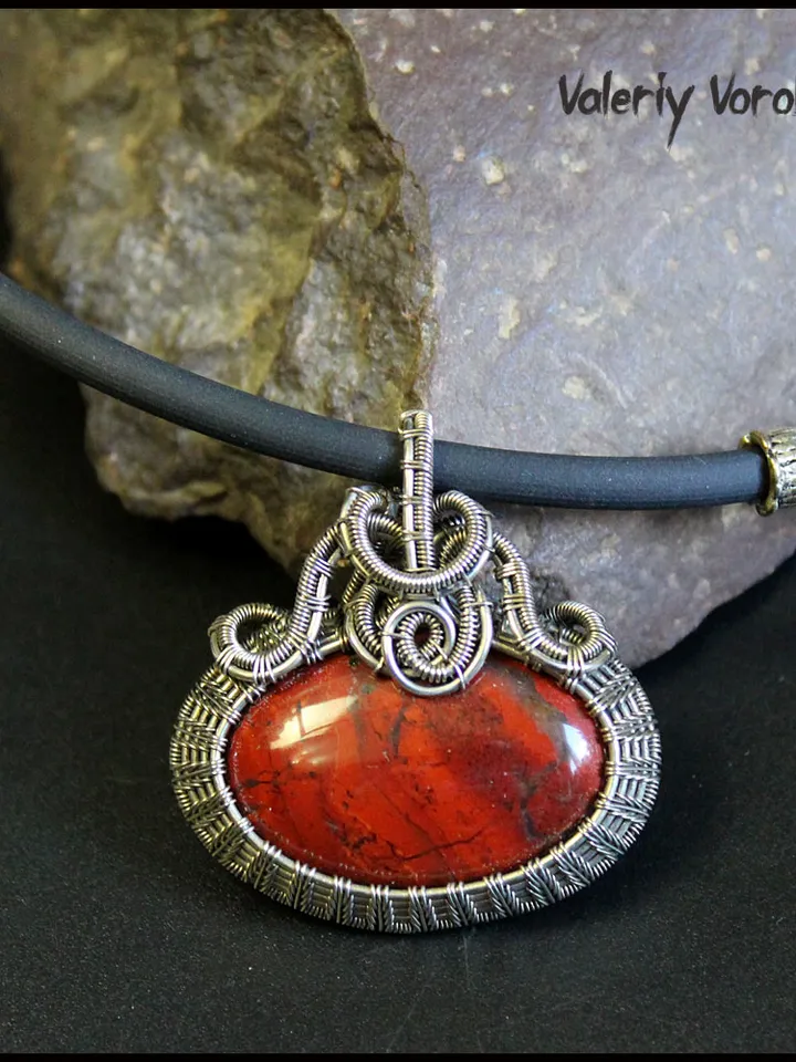 Handmade necklace with a pendant made of jasper and nickel silver wire.
