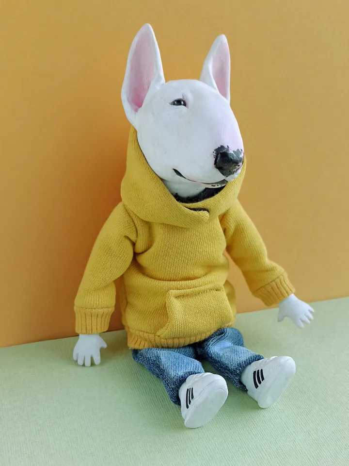 Bull Terrier doll in a yellow sweater