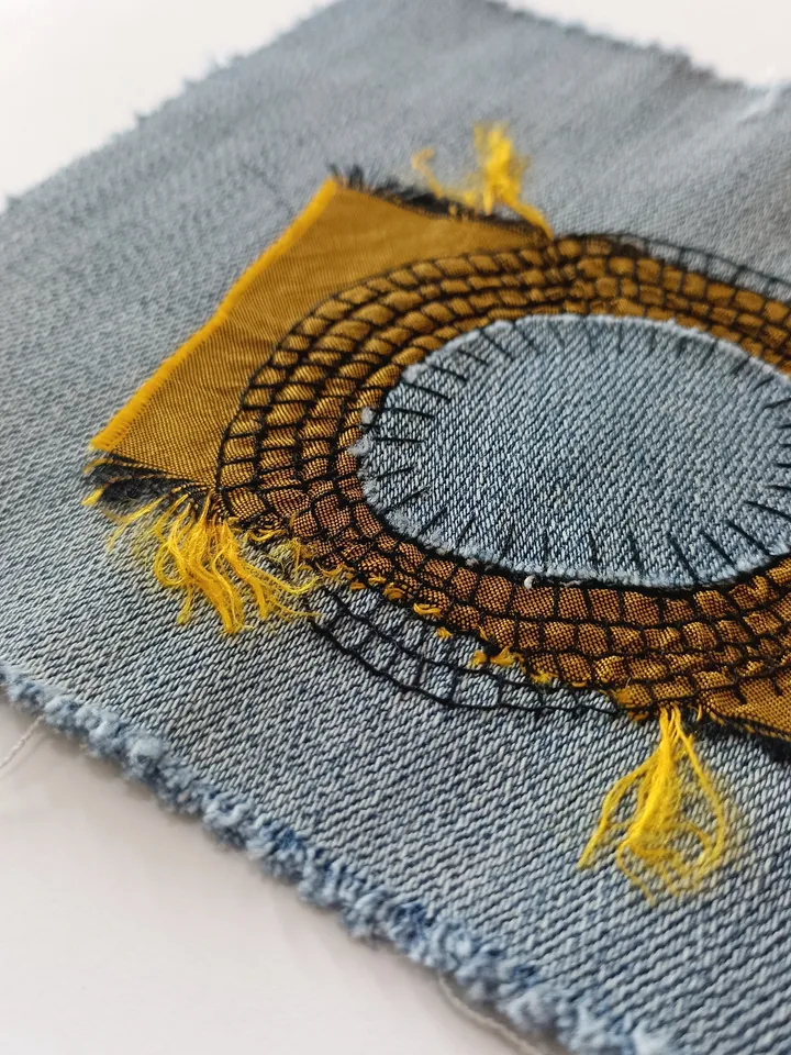 Upcycled denim boro patch. Sashiko stitching.