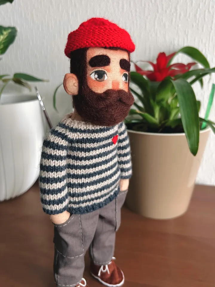 Textile doll sailor with tattoo in a dark blue striped sweater